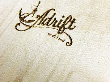 Laser engraved Cafe Adrift menus Laser engraved Cafe Adrift menus